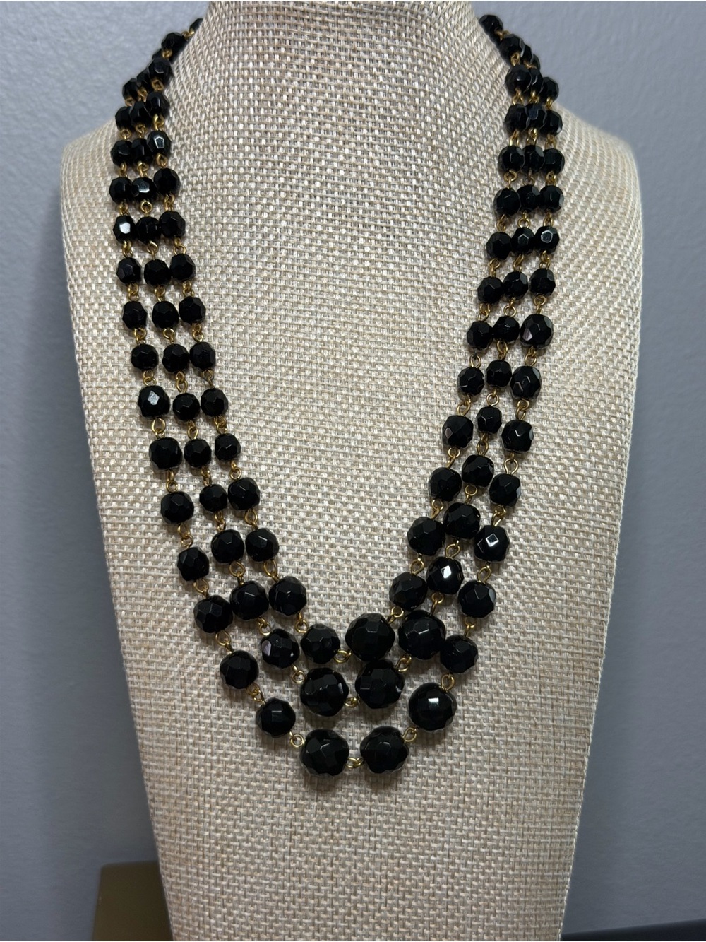 Three-Strand Black Bead Necklace with Gold Accents